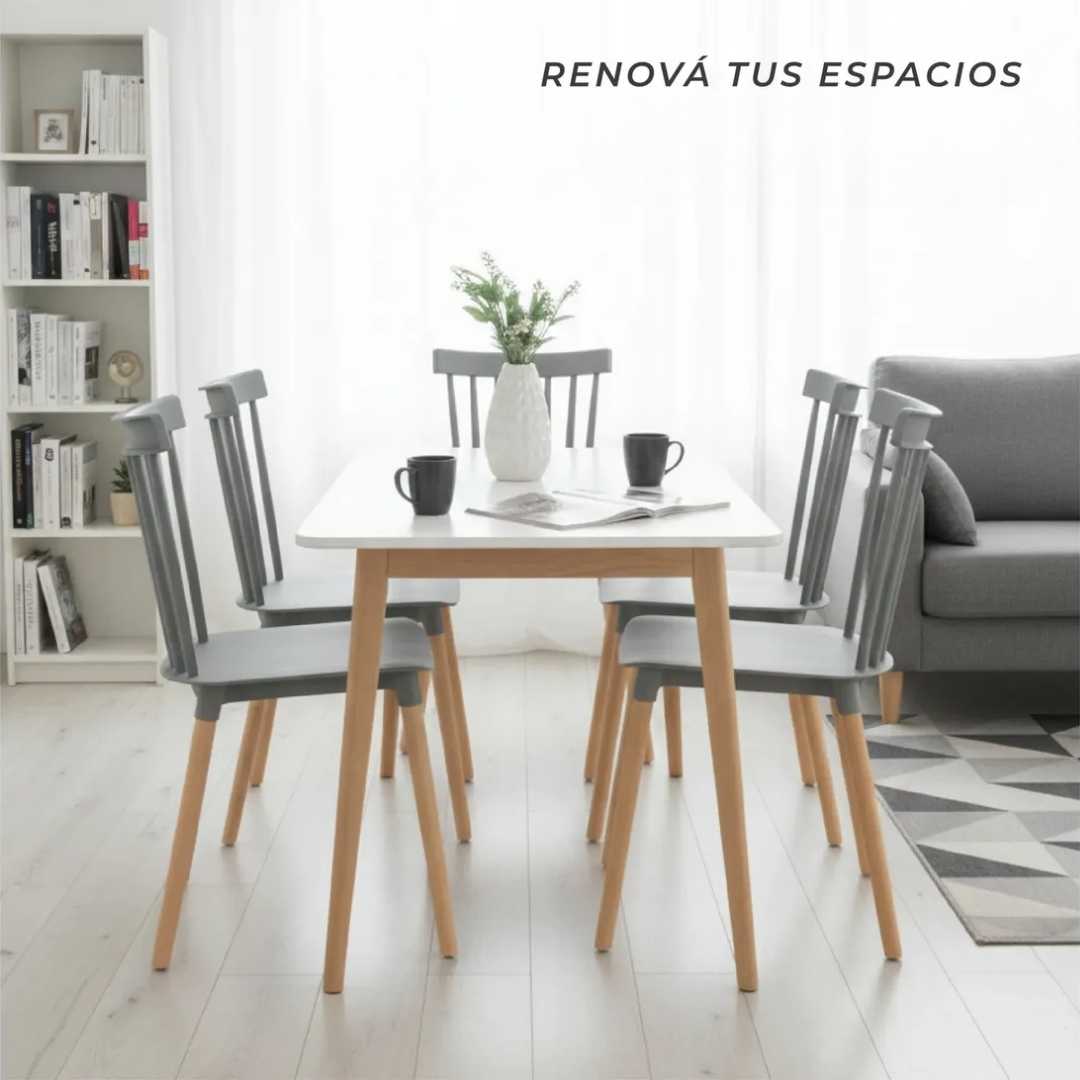 Cuatro unidades de la Silla Windsor moderna de color gris dispuestas alrededor de una mesa de comedor.